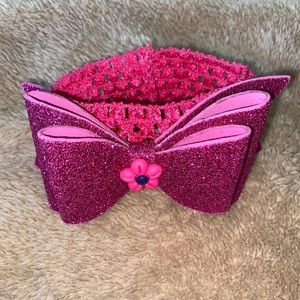 Hot pink head band with bow.